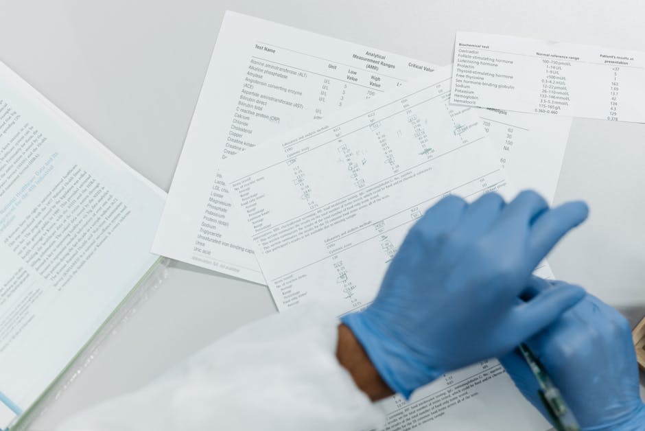 Gloved hands reviewing printed blood test lab results, representing annual blood work in preventive medicine.