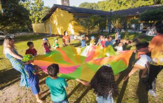 Children playing outside on a bright day, representing healthy childhood growth