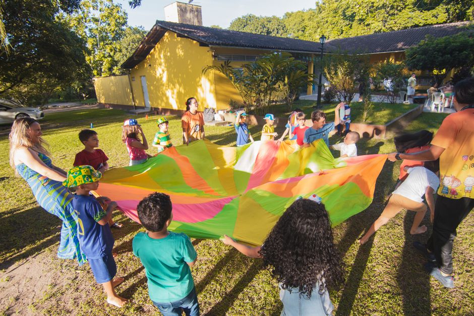 Children playing outside on a bright day, representing healthy childhood growth